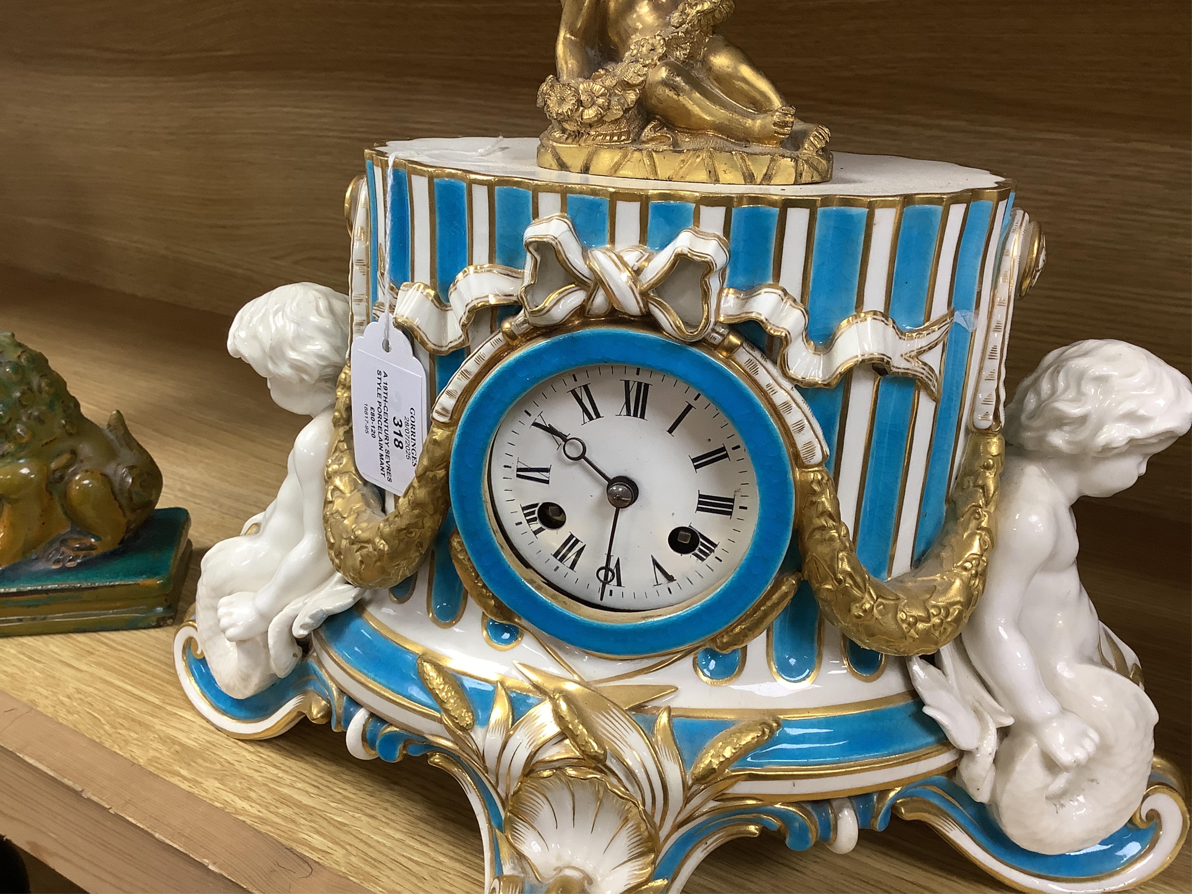 A 19th-century Sevres style porcelain mantel clock, 29cm tall